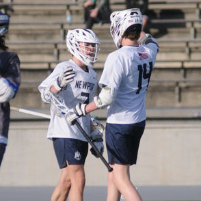 Two Lacrosse players congratulating each other