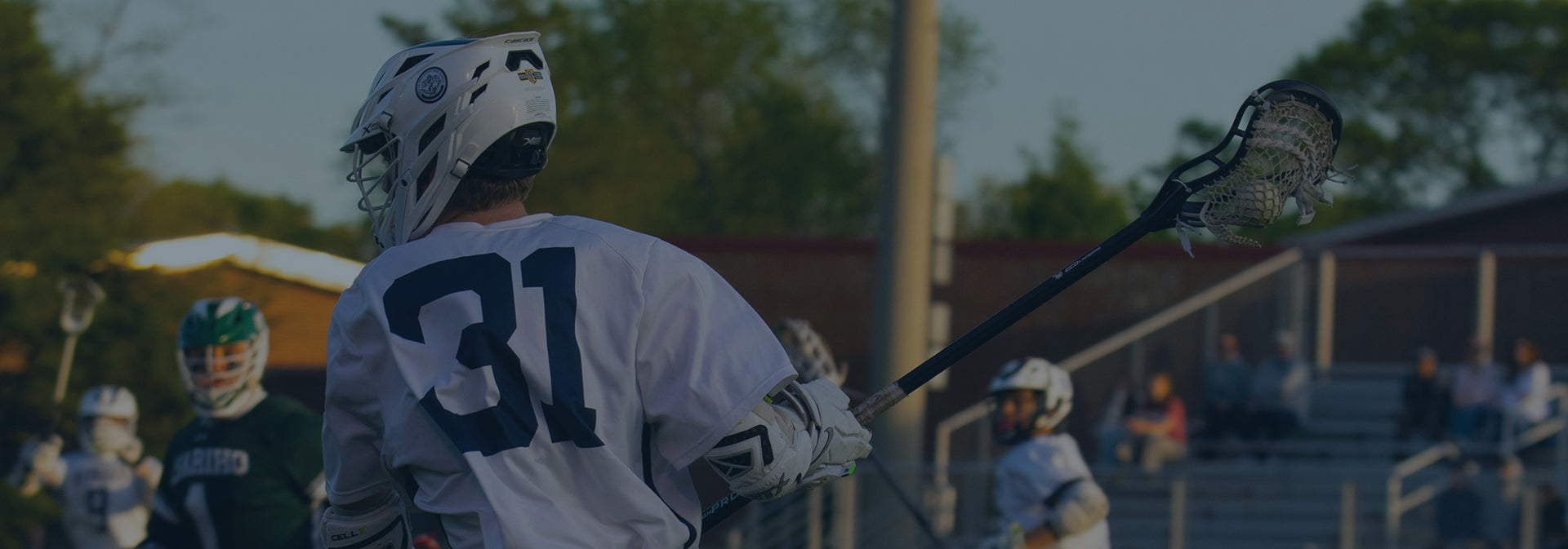Newport Harbor Lacrosse player winding up to pass a ball